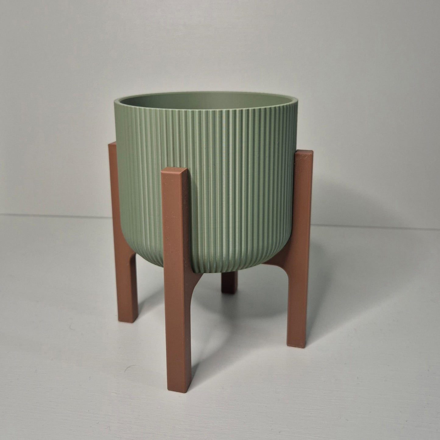 Plant pot with a stand