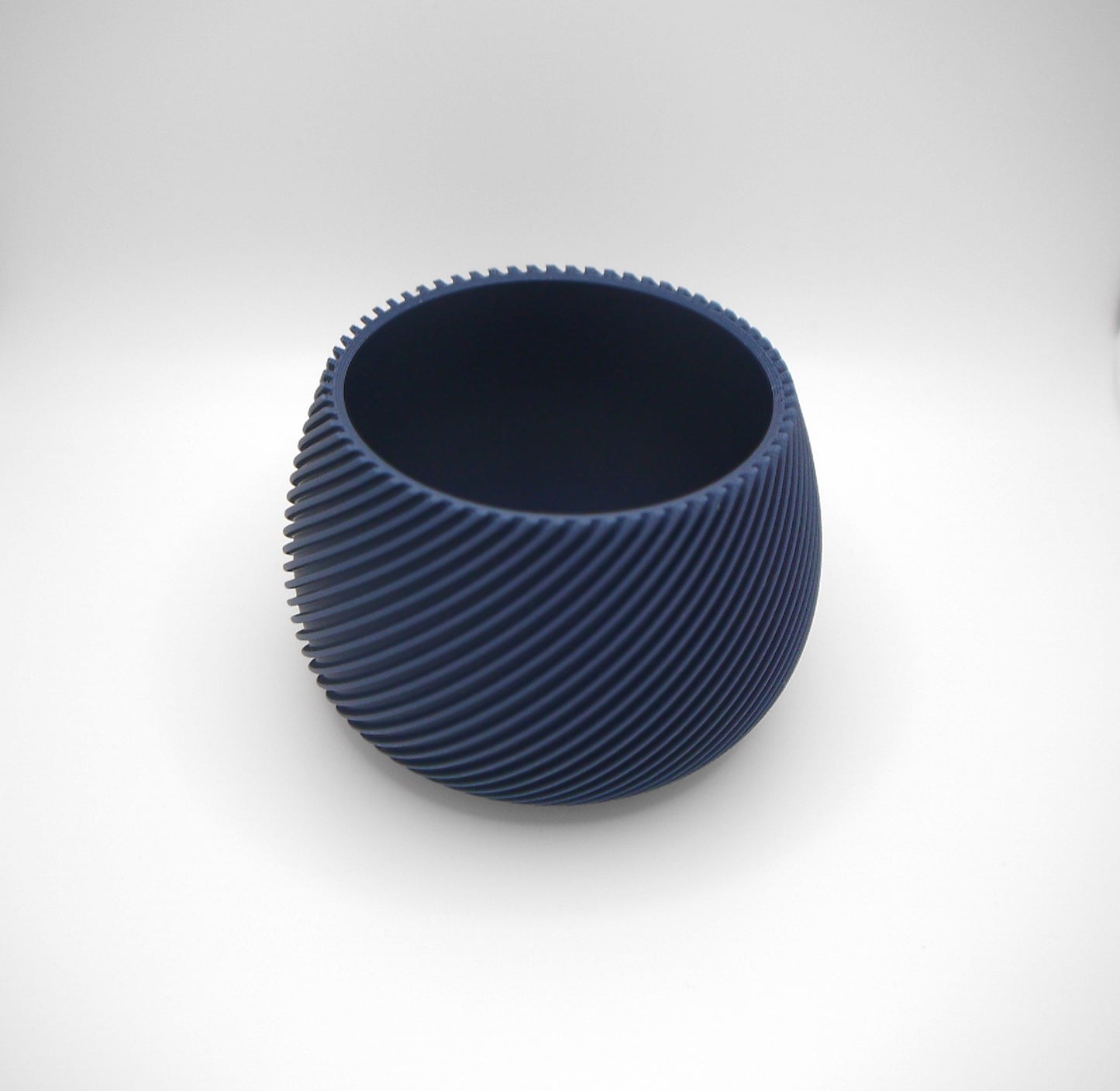 Round spiral ribbed plant pot