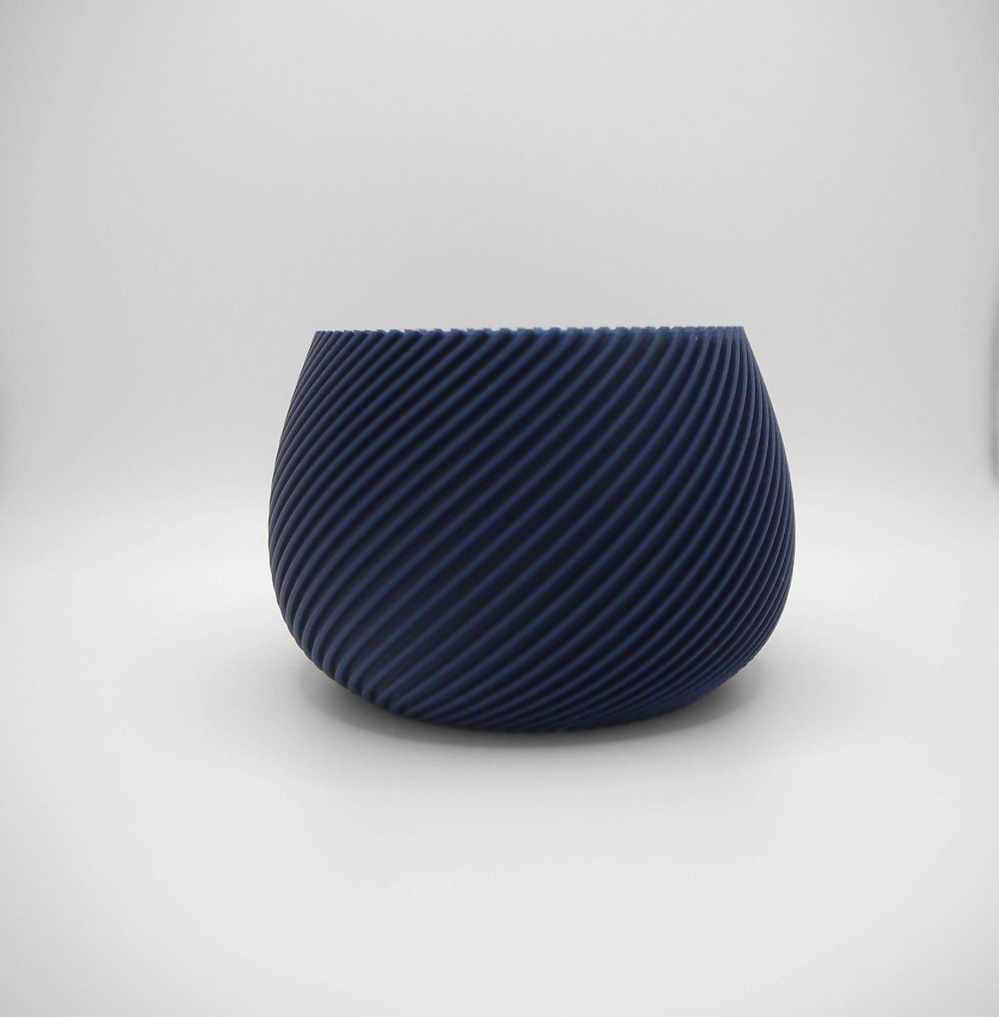 Round spiral ribbed plant pot